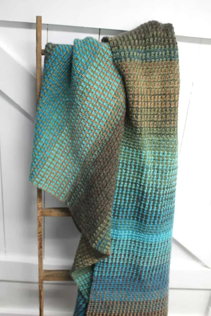 Try this easy striped linen stitch crochet blanket pattern. There is a free PDF available.