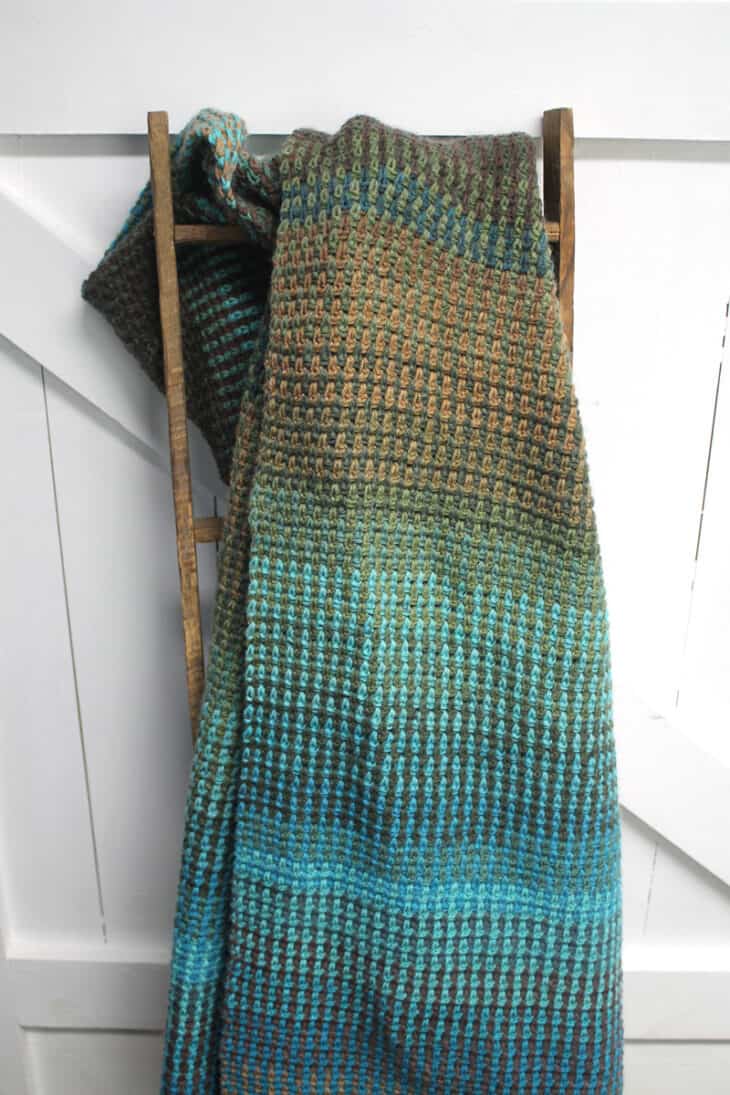 Try this easy striped linen stitch crochet blanket pattern. There is a free PDF available.