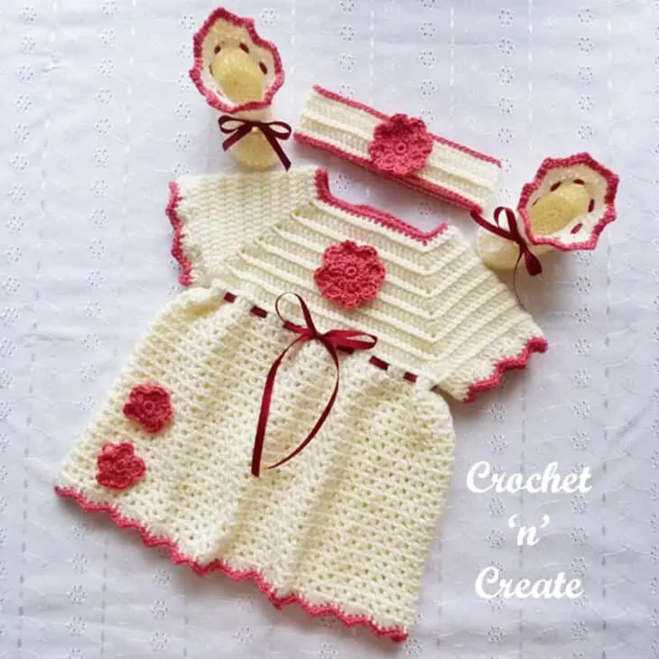 Make an whole outfit with this newborn crochet baby dress pattern. There is a pattern for a dress, booties, and headband.