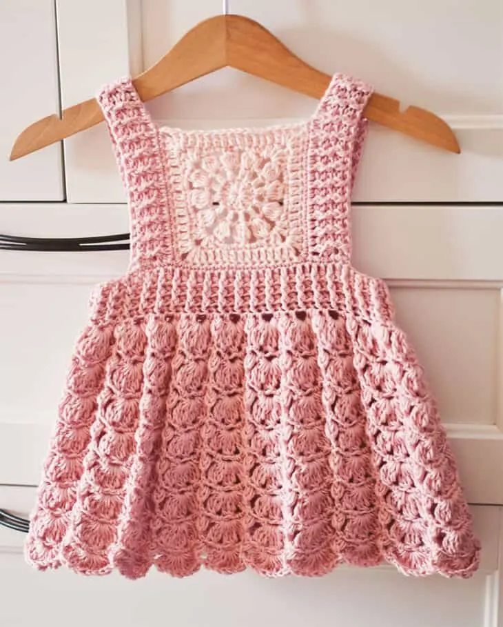 Make your own adorable granny square baby dress with this pattern. You can also make this dress up to size 8.