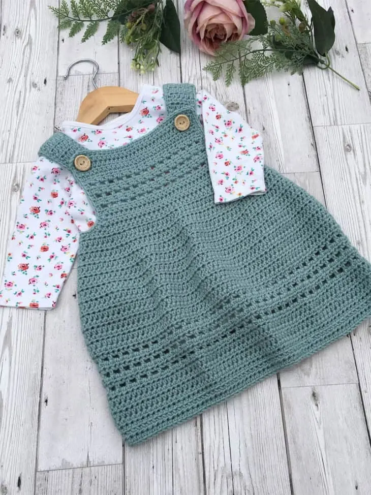 Make your own cute baby dress, pinafore style. This would work great for cooler climates. You can put a longsleeve onesie under it.