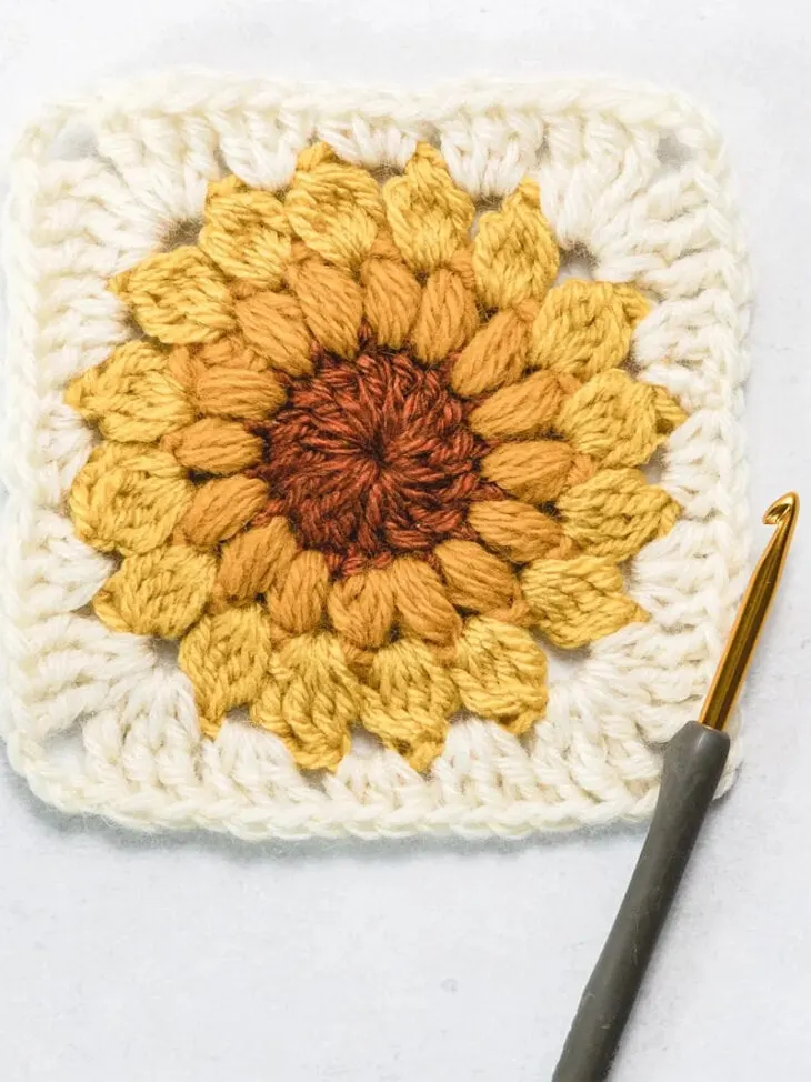Learn to make the sunflower crochet granny square pattern. Make this pretty sunburst square.