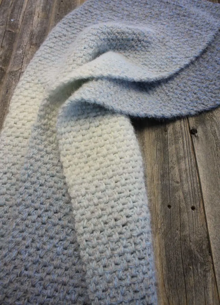 Make this easy moss stitch blanket. This crochet baby blanket pattern is an easy project using single and chain crochet stitches.