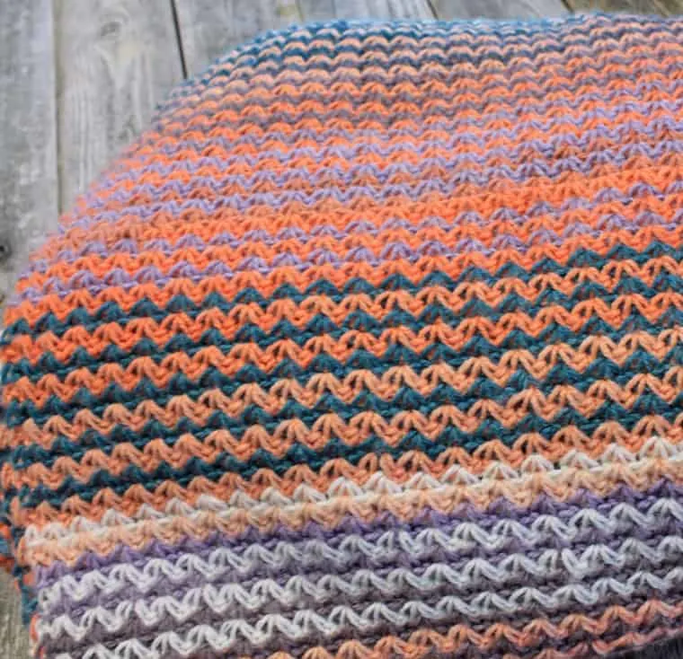Make this easy colorful crochet blanket pattern. There is a free PDF available.