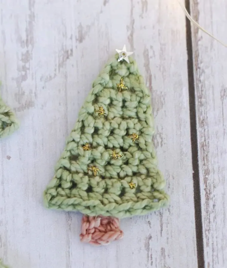 crocheted mini Christmas tree with gold stars.