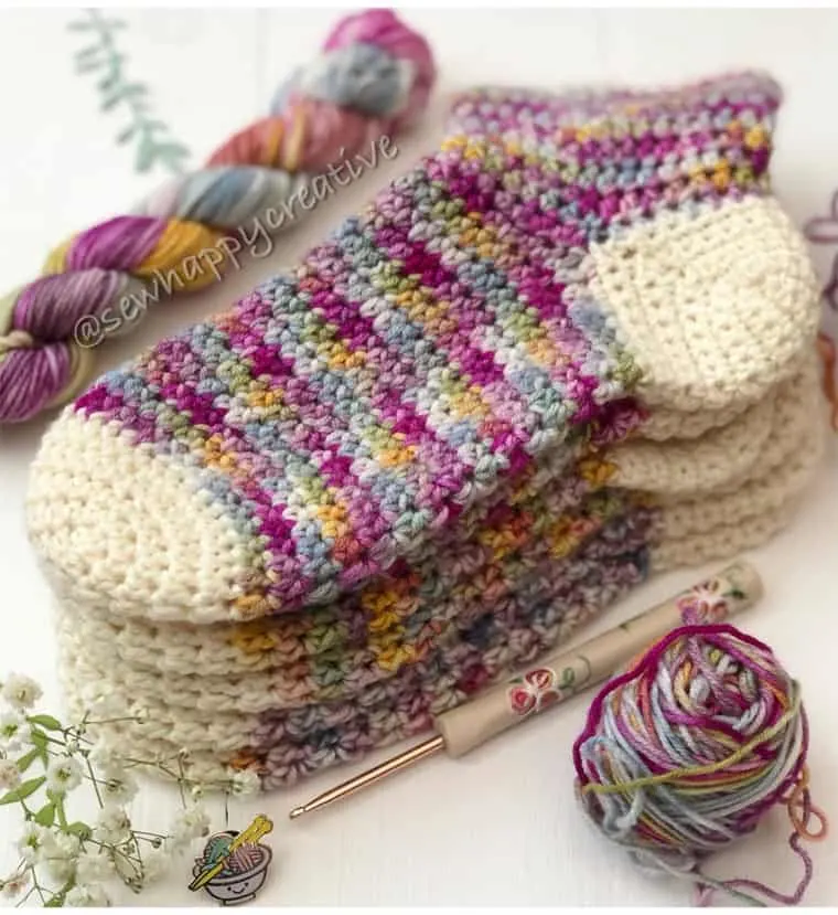 colorful crocheted sock using DK yarn.