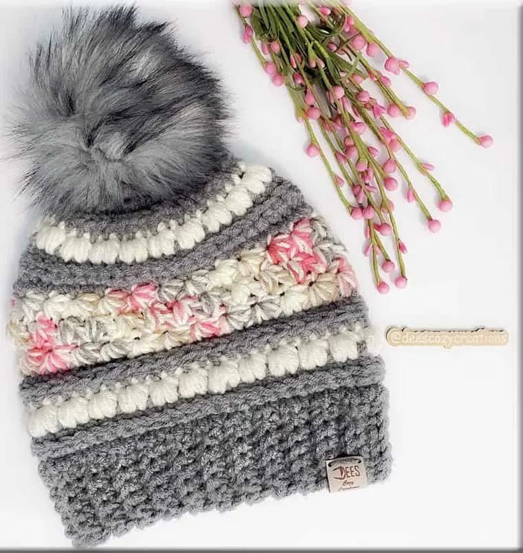 crocheted beanie with gray pom pom