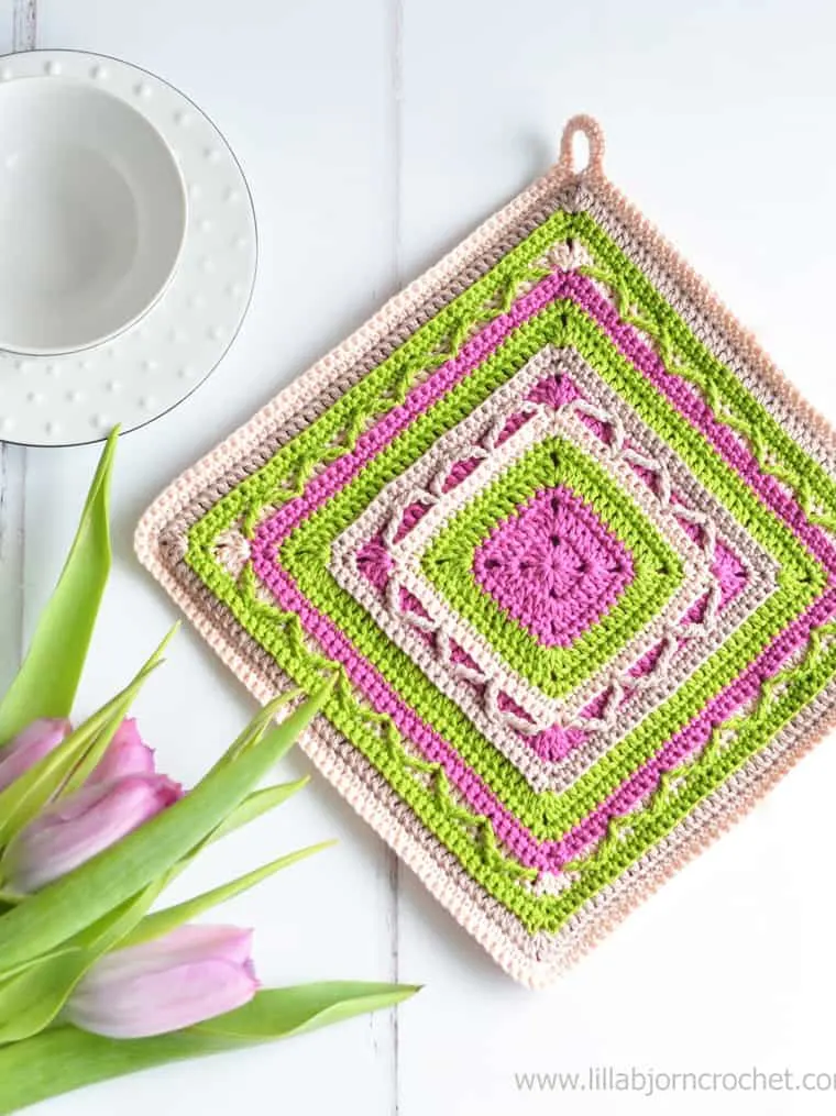 pink and green crocheted potholder square