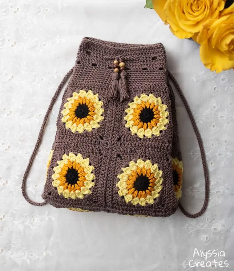 crocheted sunflower drawstring backpack