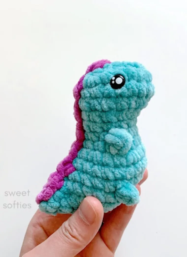 free tiny T-Rex crochet pattern little dinosaur in green and purple crocheted