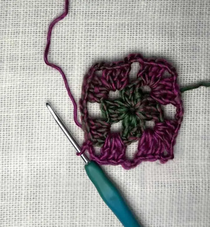 crocheted granny square in Red Heart Unforgettable Yarn in Stain Glass chain 3