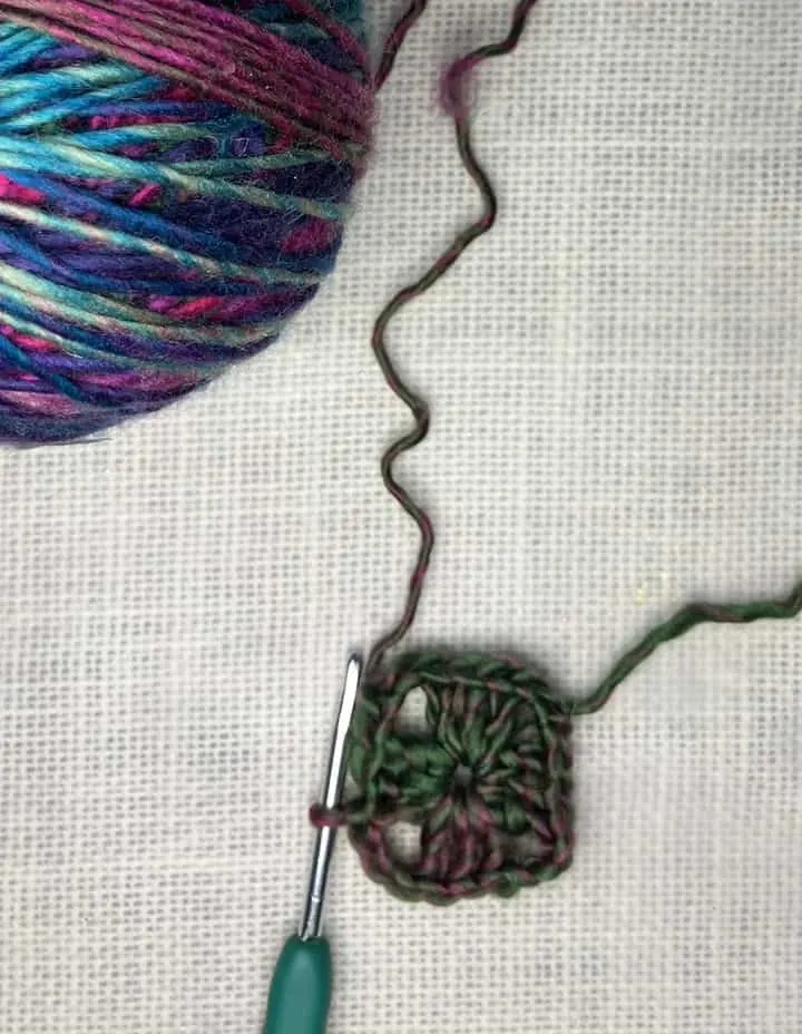 crocheted granny square in Red Heart Unforgettable Yarn in Stain Glass chain 3