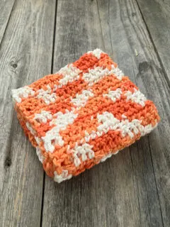 orange white crocheted brick stitch cotton washcloth