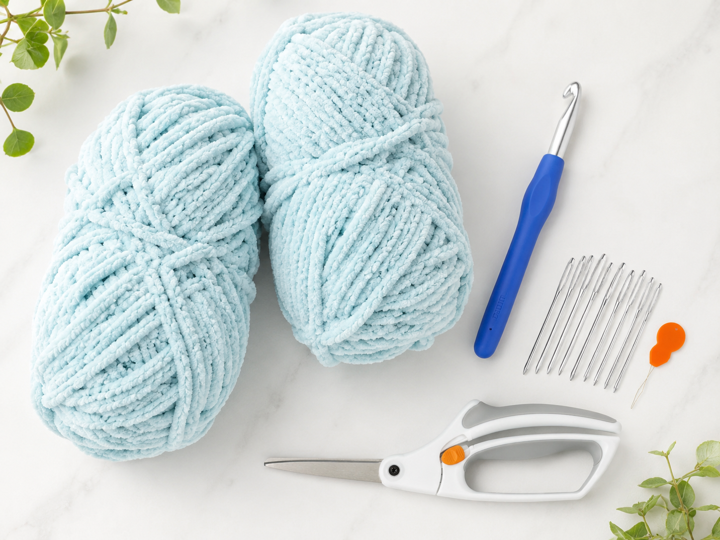 crochet supplies yarn, scissors, yarn needle, and 9 mm crochet hook